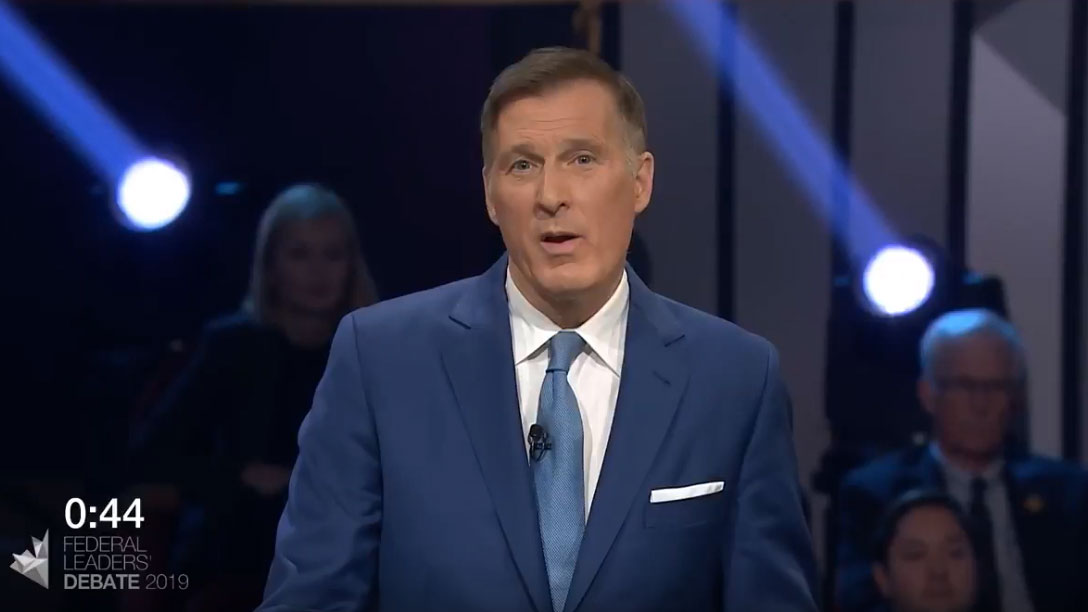 Maxime Bernier answers a question about Canada on the world stage